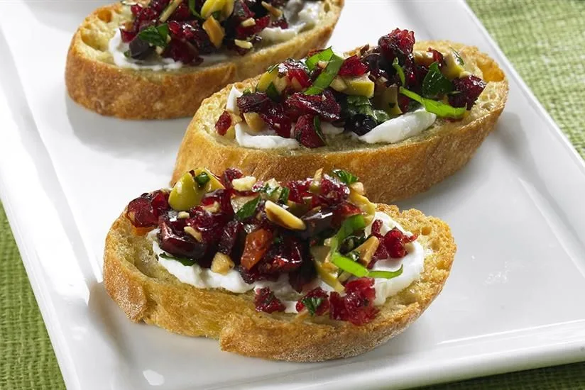 Warm Chevre Crostini with Cranberry Basil Tapenade